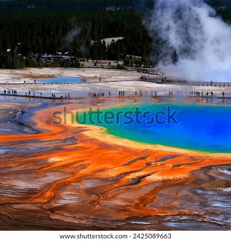 Grand Prismatice Spring in Yellowstone National Park with tourists viewing the spectacular natural scene Royalty-Free Stock Photo #2425089663