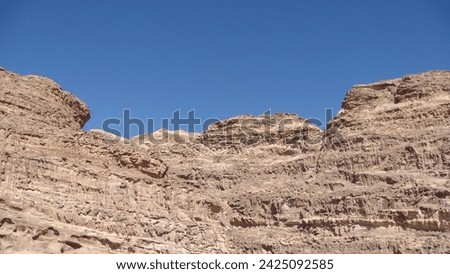 Petra is a famous archaeological site in Jordan's southwestern desert. Dating to around 300 B.C., it was the capital of the Nabatean Kingdom. Accessed via a narrow canyon called Al Siq, Royalty-Free Stock Photo #2425092585