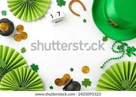 St. Patrick's Day delight: A tapestry of festive cheer. Top view of green hat, shamrocks, golden coins, horseshoe, calendar set, paper props on a white background with space for festive messages