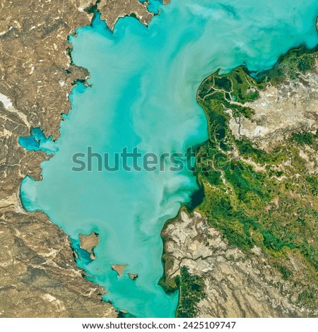 Lake Balkhash. Spanning 17,000 square kilometers, Lake Balkhash is the largest lake in Central Asia and fifteenthlargest in the world. Elements of this image furnished by NASA.