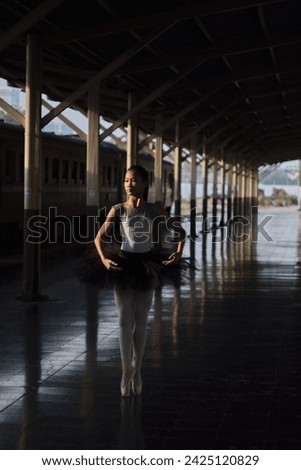 Young ballerina in ballet costume dancing and feeling breath of big city