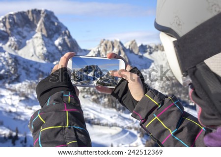 Photographing winter landscape mountains and snow, with cell phone