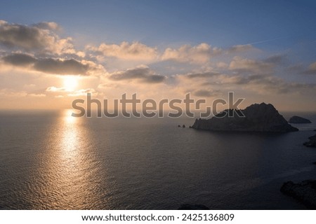 Panorama of the Ile Maïre, English : Maire Island in Marseille, France, by sunset. Picture taken from the Callelongue Calanque. Beautiful reflection of the sunlight in the water.