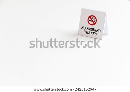 A sign indicating that this is a non-smoking seat