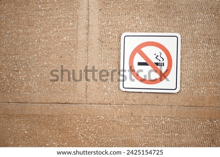 No smoke sign on a wall 