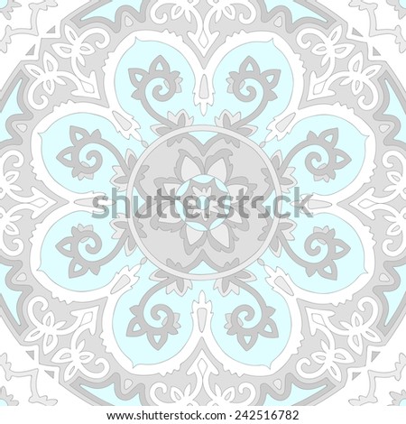 Ornamental ethnicity pattern in cold colors. The circular arrangement of stalks and leaves. Ornament of light pastel gray and white elements.