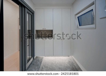 Install lighting under the shoe rack for a stylish look Royalty-Free Stock Photo #2425181801