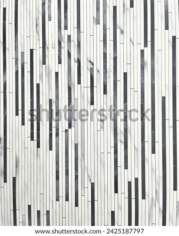 Black and white striped indoor bathroom ceramic material wall pattern design. Close up interior photography image isolated on vertical ratio background.