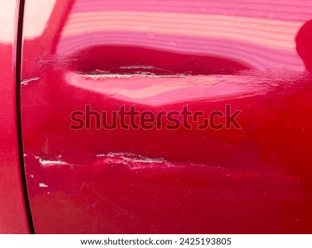 Deep scratches on the car body due to accident Royalty-Free Stock Photo #2425193805