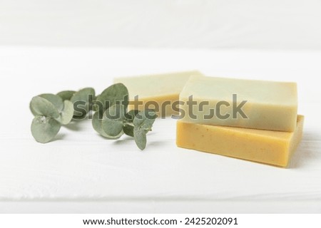 Soap on a texture background. Soap with eucalyptus extract and natural herbs on a white background. Beautiful Natural soap bars. Handmade organic soap concept. Skin care. banner