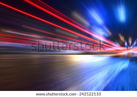 Blurred car lights, long exposure photo of traffic Royalty-Free Stock Photo #242522110
