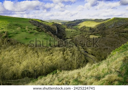 Wetton provides wonderful scenic meadows, fields, stiles and walking, including the popular descent to Thor's Cave. Royalty-Free Stock Photo #2425224741