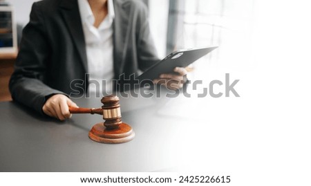 justice and law concept.Male judge in a courtroom on wooden table and Counselor or Male lawyer working in office. 

