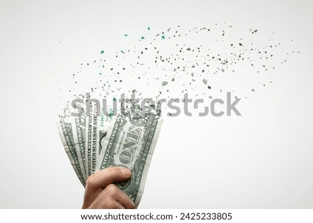 US Dollar Bills Disappear Into Thin Air Royalty-Free Stock Photo #2425233805