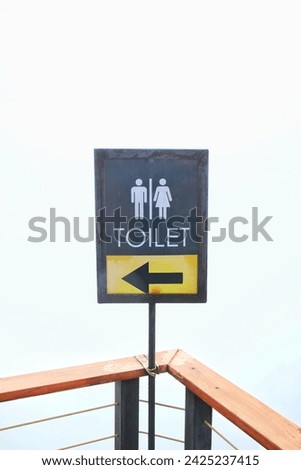 toilet sign with fog background