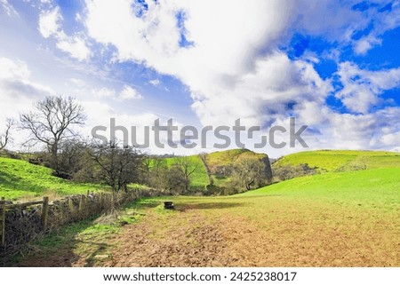 Wetton provides wonderful scenic meadows, fields, stiles and walking, including the popular descent to Thor's Cave. Royalty-Free Stock Photo #2425238017