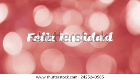 Image of feliz navidad text over red spots of light background. Christmas, tradition and celebration concept digitally generated image.