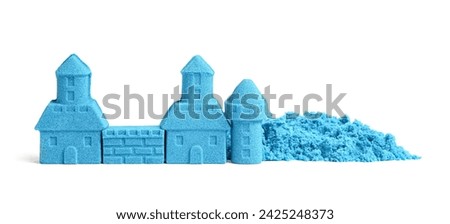 Castle made of blue kinetic sand isolated on white Royalty-Free Stock Photo #2425248373