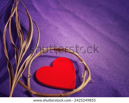 Lent Season, Holy Week, Ash Wednesday, Palm Sunday and Good Friday concepts. Close up crown of thorns, heart and palm leaf in purple background. Stock photo.