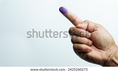 Finger with purple ink as a sign of having voted in the election isolated on a white background
