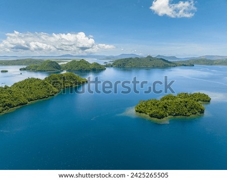 Beautiful landscape of tropical islands and blue sea. Blue skies and clouds. Mindanao, Philippines.