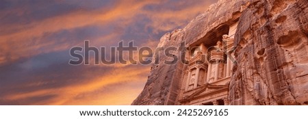 Al Khazneh or The Treasury (against the background of a beautiful sky with clouds). Petra, Jordan-- it is a symbol of Jordan, as well as Jordan's most-visited tourist attraction Royalty-Free Stock Photo #2425269165