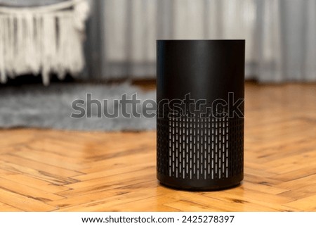 Air purifier health technology in cozy modern living room and cleaning removing dust PM2.5, Air purifier for fresh air and healthy life, Health care Air Pollution Concept. clean dust and fresh home Royalty-Free Stock Photo #2425278397