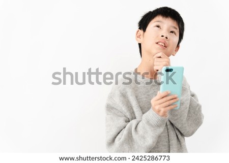 Lifestyle image of an elementary school boy in casual clothes