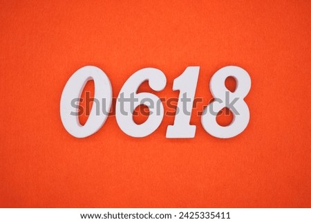 Orange felt is the background. The numbers 0618 are made from white painted wood.