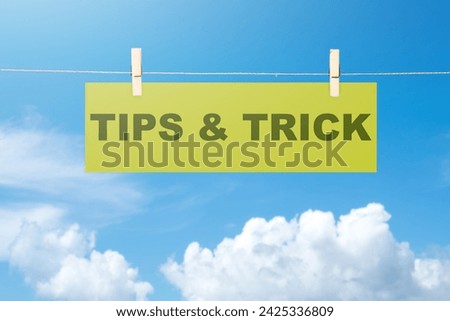 Paper hanging on the rope with Tips and Trick text. Tips and advice concept