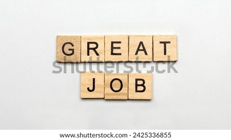 The row of wooden cubes with 'Great job' text on a white background. Appreciation concept 