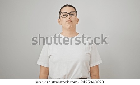 Young beautiful hispanic woman standing with upset expression over isolated white background