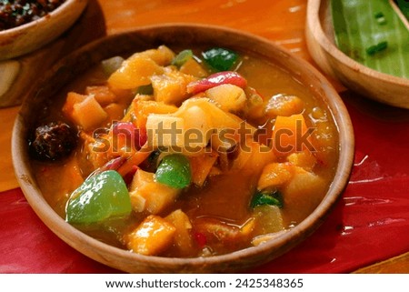 Typical Acehnese rujak which is rich in fresh fruit with thick spices. Royalty-Free Stock Photo #2425348365