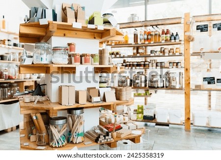 Zero waste shop interior. Wooden shelves with varieties of cosmetic products. Eco-friendly shopping at local store. Small business of plastic free grocery store.