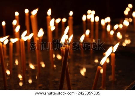 An image that captures candles burning for loved ones and for those who have passed away.