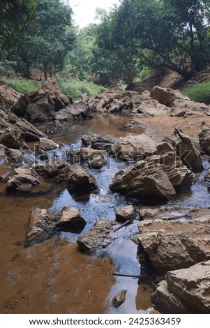 The rocks in the mineral water flow naturally