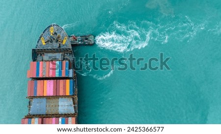 tug boat are pulling Cargo container ship to customs port import export goods to cargo yard port to customs. concept logistics transportation and shipping.	

