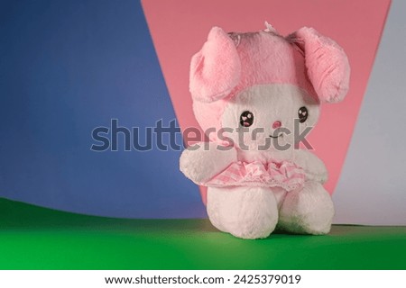 Sitting there, fluffy toy. Cute children's toy with long ears. Selective focus.