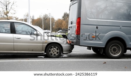 Car crushed hood bumping into truck, dangerous. Call an insurance company representative. Right to recover funds from guilty driver. Passing an alcohol test. Deprivation rights or fine in court Royalty-Free Stock Photo #2425386119