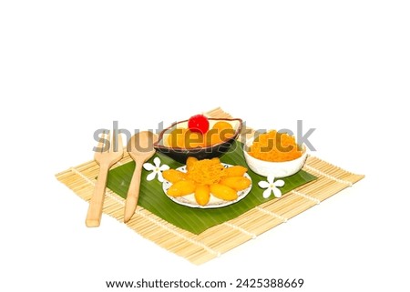 Mixed of dessert of Thailand with Foi Thong Dessert and Thong Yod dessert put on bamboo mat,isolated picture.