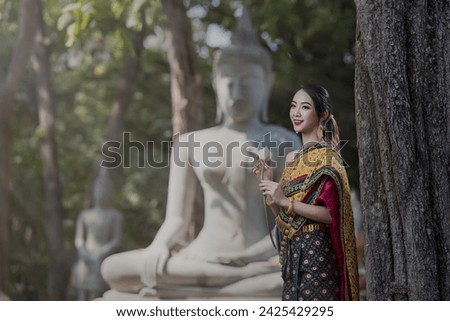 women in traditional clothing  on Buddhist on background.  Portrait women in traditional clothing , Thai traditional  in Ayutthaya, Thailand. Royalty-Free Stock Photo #2425429295