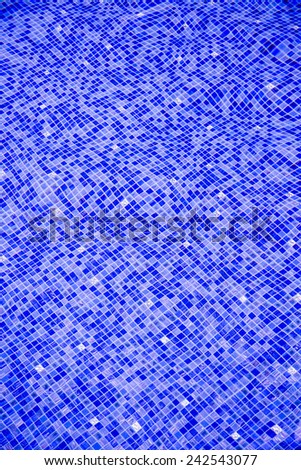 Mosaic floor in swimming pool in blue tone