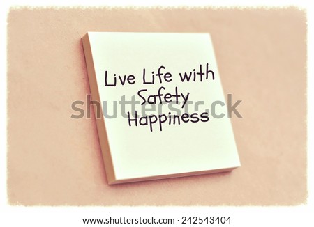 Text live life with safety happiness on the short note texture background