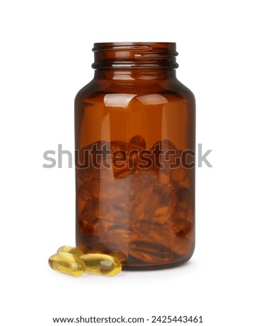 Jar and vitamin capsules isolated on white