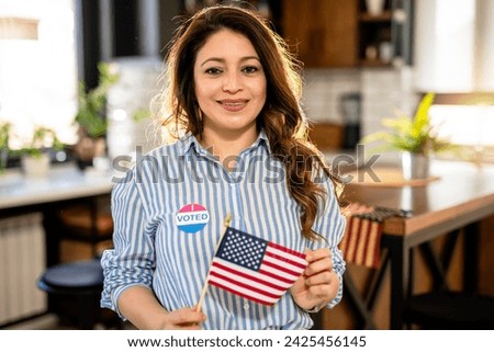 Latino woman voted in the American elections. Royalty-Free Stock Photo #2425456145