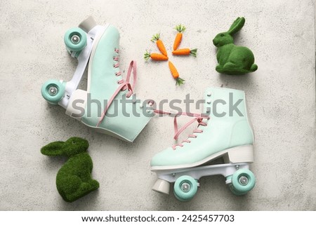 Vintage roller skates with toys bunny and carrots on white background. Easter celebration