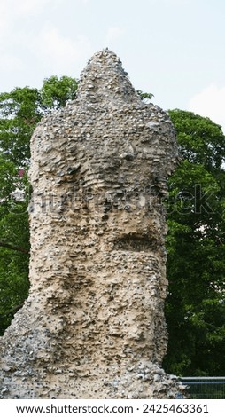 This image is part of the ruins of the abbey in Bury St Edmunds. I love the way it looks like there is a face in it where the stone has worn away. Royalty-Free Stock Photo #2425463361