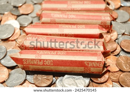 Rolled American Penny Coinage on Assorted Coinage Royalty-Free Stock Photo #2425470145