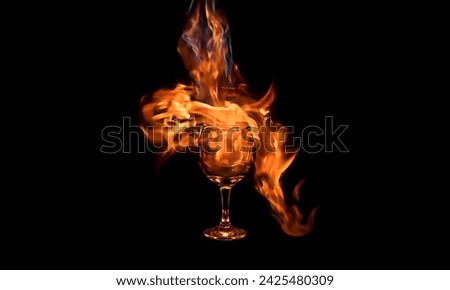pouring real fire into a wine glass Royalty-Free Stock Photo #2425480309