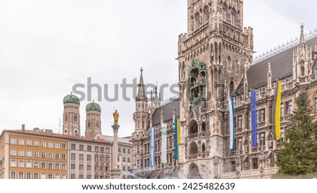 Music show on Clock Tower or Glockenspiel section of bell play timelapse, Munich, Germany. Detail of Rathaus (New Town Hall) with chime in city center. It is landmark located on Marienplatz square Royalty-Free Stock Photo #2425482639